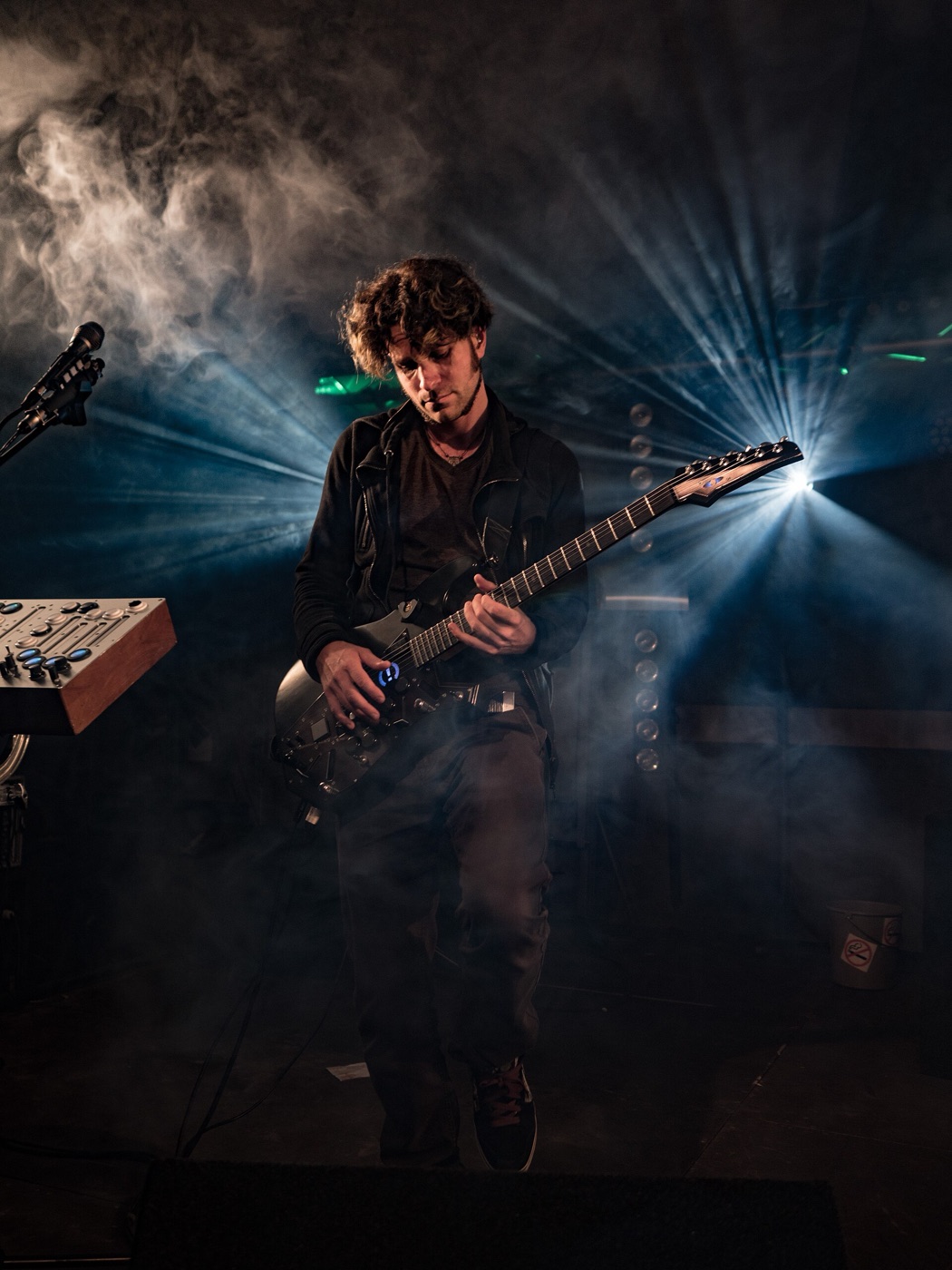 Moldover performing at SHA2017, lit from below.
