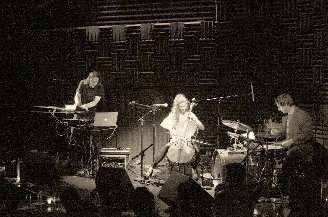 Lucibel Crater on stage: Sarth Calhoun at keyboards and laptop, Leah Coloff on cello, Paul Chuffo on drums.